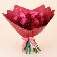 Crimson and Pink Rose Charm Bouquet with deep red roses, bright pink roses, luxury red wrapping, and ribbon by Rapid Petals by Yashken Fresh