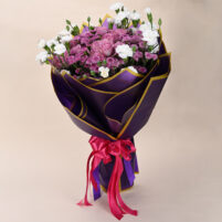 Lavender Blush Harmony pink and white flower bouquet with lavender-pink roses, white carnations, pink spray blooms, purple wrap, gold edging, and pink ribbon by Rapid Petals by Yashken Fresh