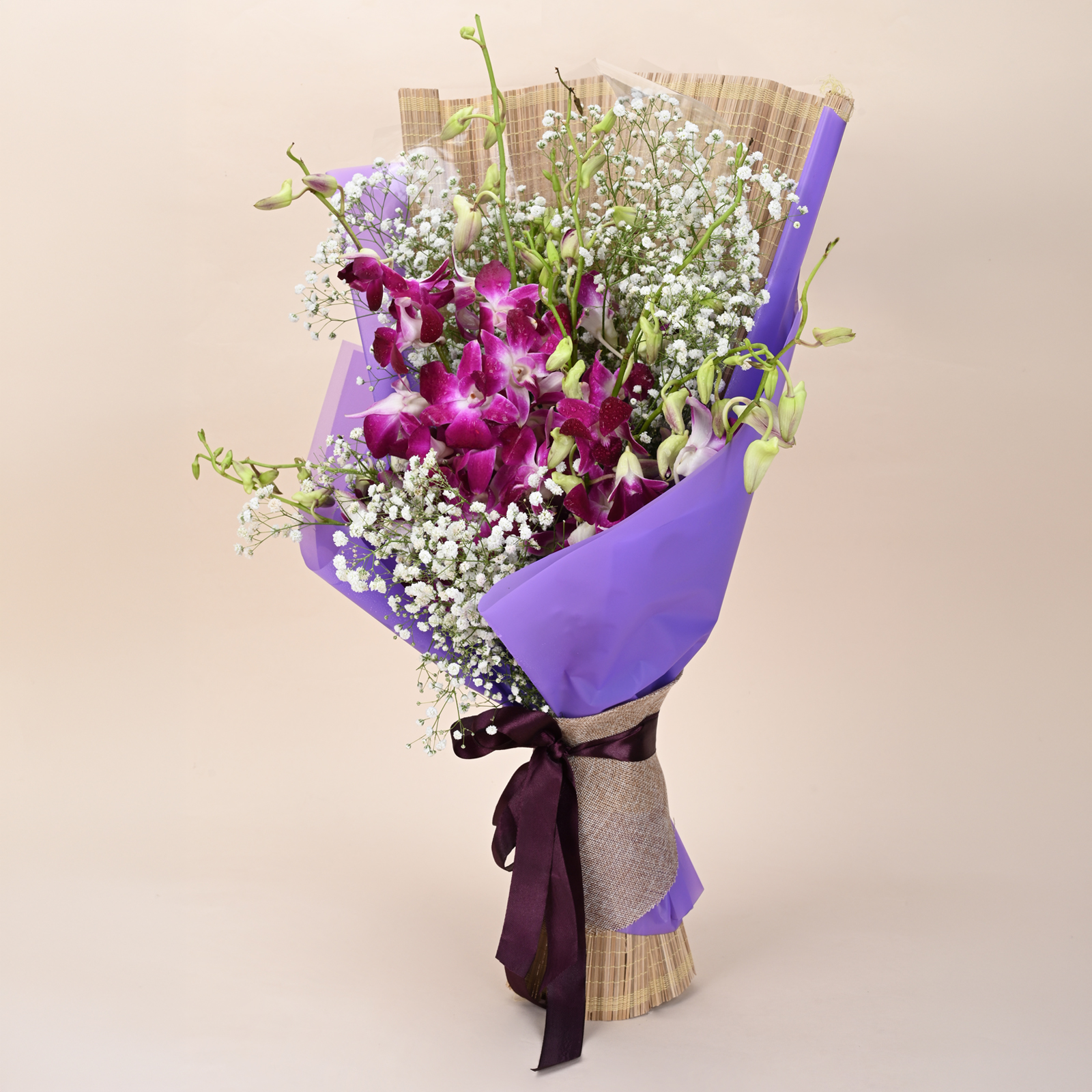 Orchid Mist Grace purple orchid bouquet with baby’s breath and rustic wrap by Rapid Petals by Yashken Fresh