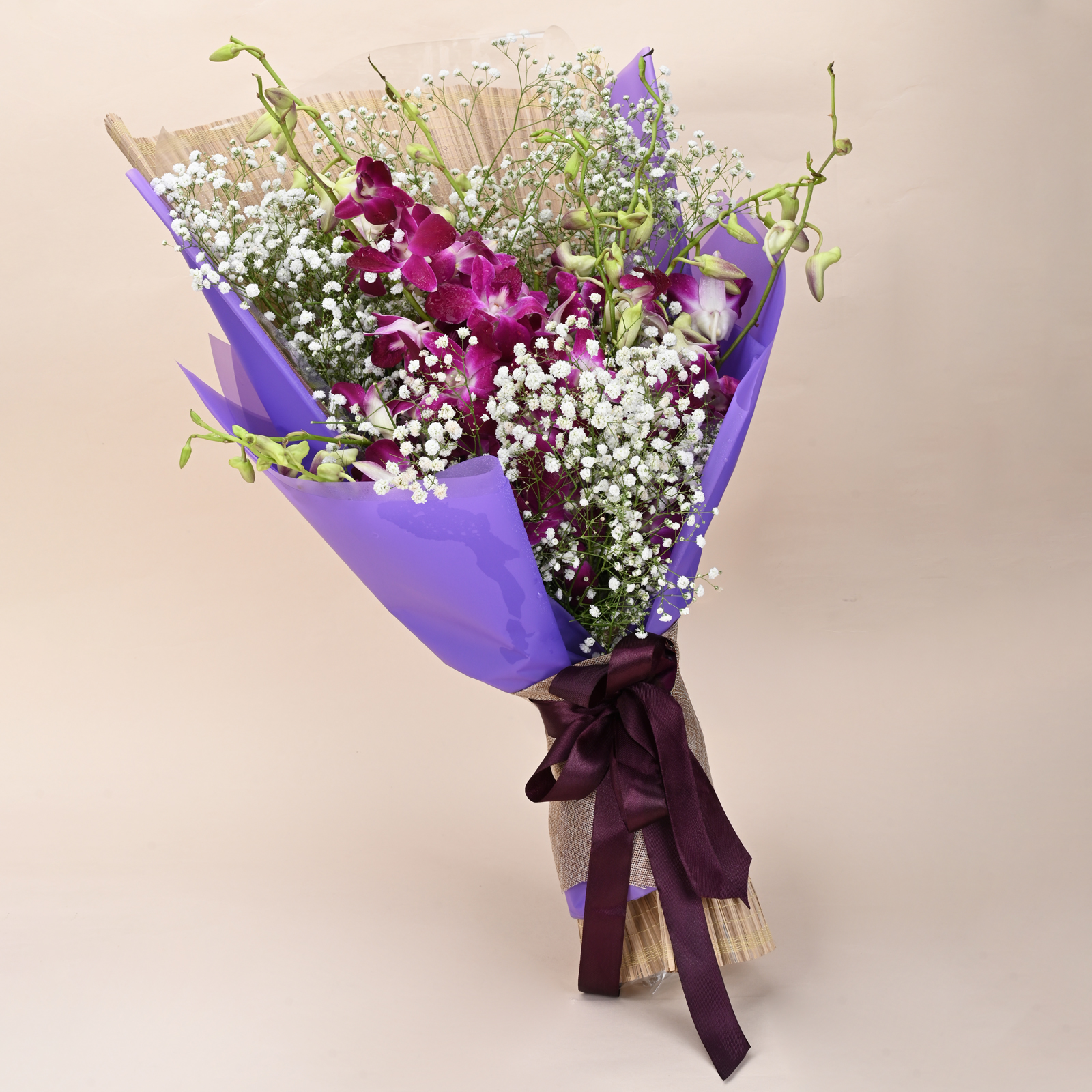 Orchid Mist Grace purple orchid bouquet with baby’s breath and rustic wrap by Rapid Petals by Yashken Fresh