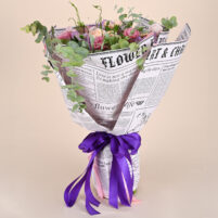 Blush Eucalyptus Grace blush pink and peach flower bouquet with purple blooms, eucalyptus greenery, newspaper-style wrap, and purple ribbon by Rapid Petals by Yashken Fresh