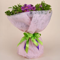 Purple Pink Garden Bouquet with purple flowers, pink roses, fresh green foliage, light pink floral wrap, green ribbon, and purple ribbon accents by Rapid Petals by Yashken Fresh