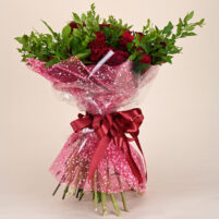 Ruby Garden Embrace red rose and ruby carnation bouquet with fresh green foliage, pink glitter wrap, clear wrap, and red ribbon by Rapid Petals by Yashken Fresh