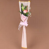Blush Pearl Rose single pink rose bouquet with baby’s breath, green foliage, blush-pink wrapping, gold border, and pink decorative bow by Rapid Petals