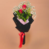 Crimson Noir Rose Duo red rose bouquet with two red roses, baby’s breath, green fillers, black-gold wrapping, pink inner paper, and red satin ribbon by Rapid Petals
