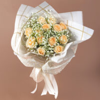 Ivory Gold Grace ivory rose bouquet with cream roses, baby’s breath, fresh greenery, white pearl mesh wrap, gold-line paper, and white satin ribbon by Rapid Petals by Yashken Fresh