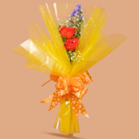 Sunny Orange Embrace orange rose bouquet with purple chrysanthemum, baby’s breath, yellow net wrap, and orange heart ribbon by Rapid Petals by Yashken Fresh